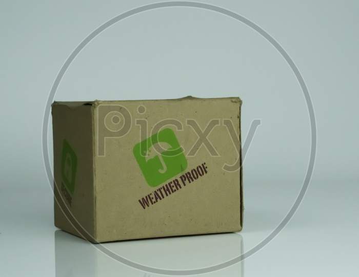 An used cardboard paper carton water proof written isolated