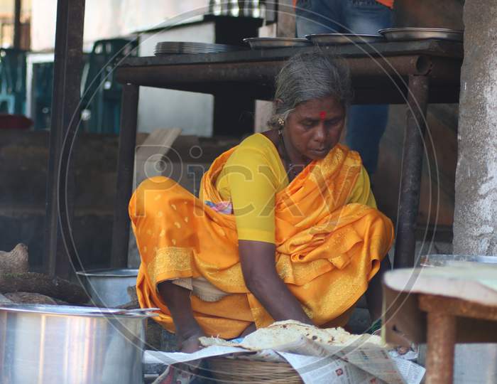 old Indian Women making Bhakri