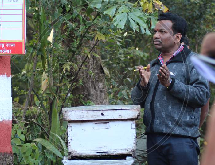 a man explaining about apiculture