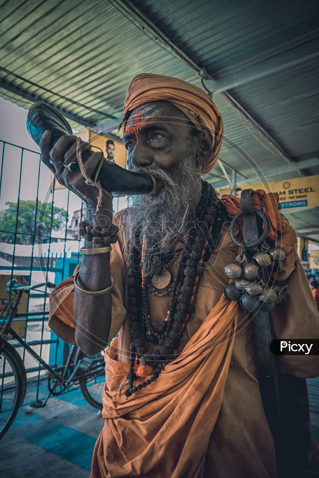 Tarakeswar, India – April 21 2019; An Unidentified Sadhu Blows Conch At Baba Taraknath Temple, A Hindu Temple Dedicated To God Shiva. The Temple Is An Atchala Structure Of Bengal Temple Architecture.