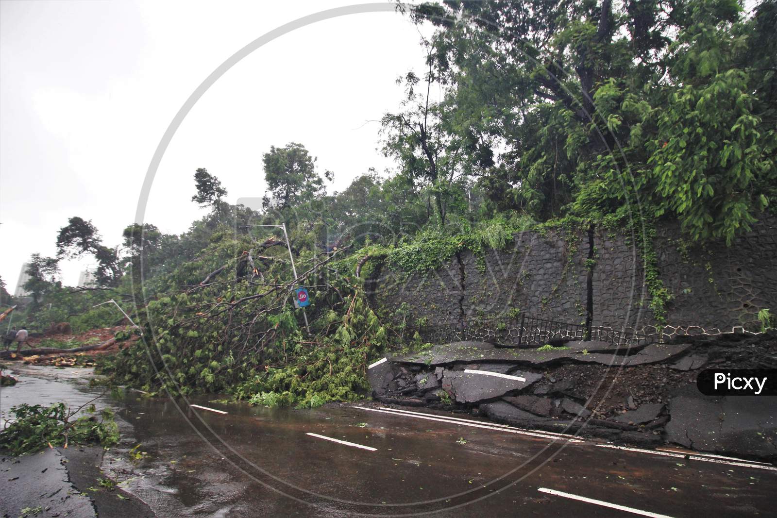 A general view shows the site of a collapsed portion of a retaining wall along a road following heavy rainfall, in Mumbai, India on August 6, 2020.