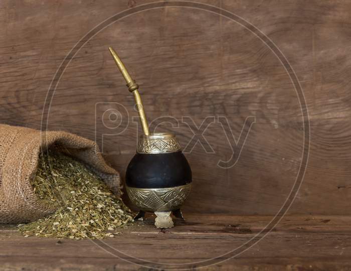 Mate And Yerbamate On Rustic Wooden Background. Traditional South American Infusion