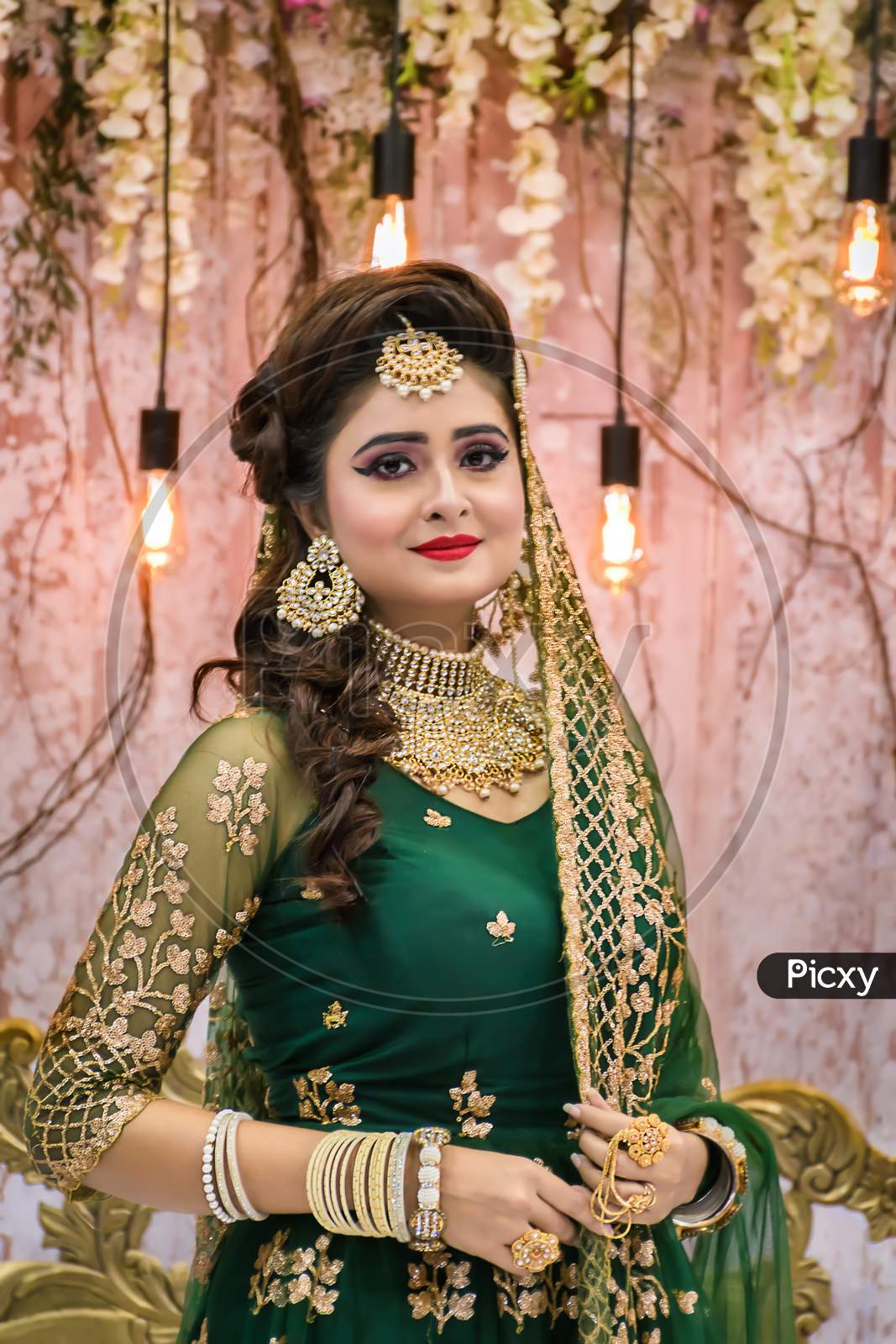 Portrait Of An Indian Bride Standing With Glamorous Outfit And Jewellery With Makeup In A Banquet Hall. Traditional Indian Bride In Wedding In Kolkata, India On January 2020