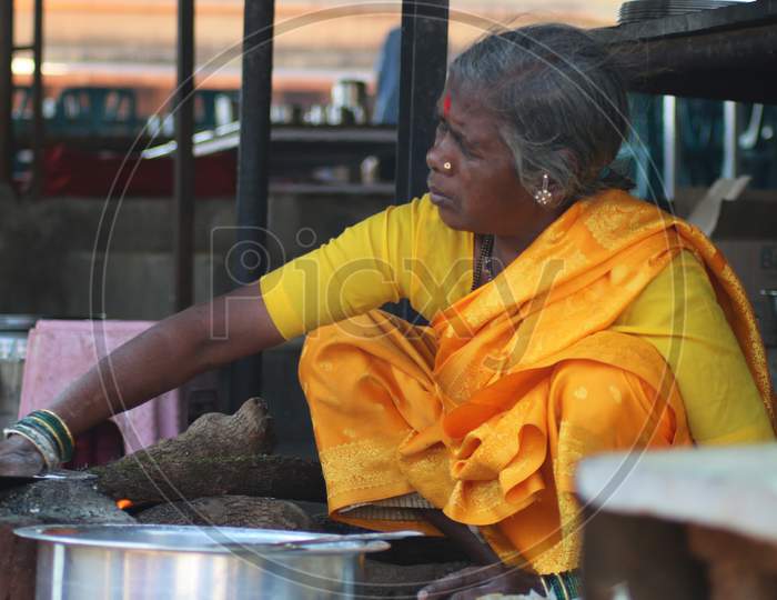 old Indian Women making Bhakri