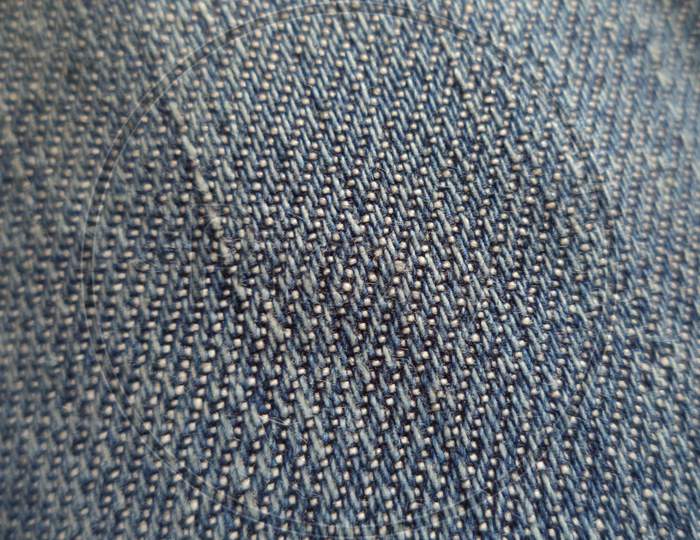 A macro picture of denim jeans.