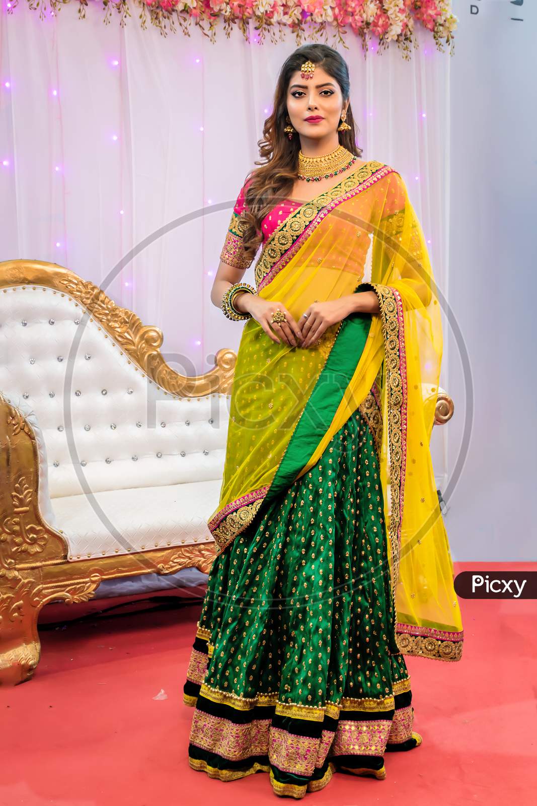 Fashion Portrait Of Beautiful Indian Female Model In A Traditional Indian Saree Wearing Gold Jewellery And Bangles In Kolkata, India On January 2020