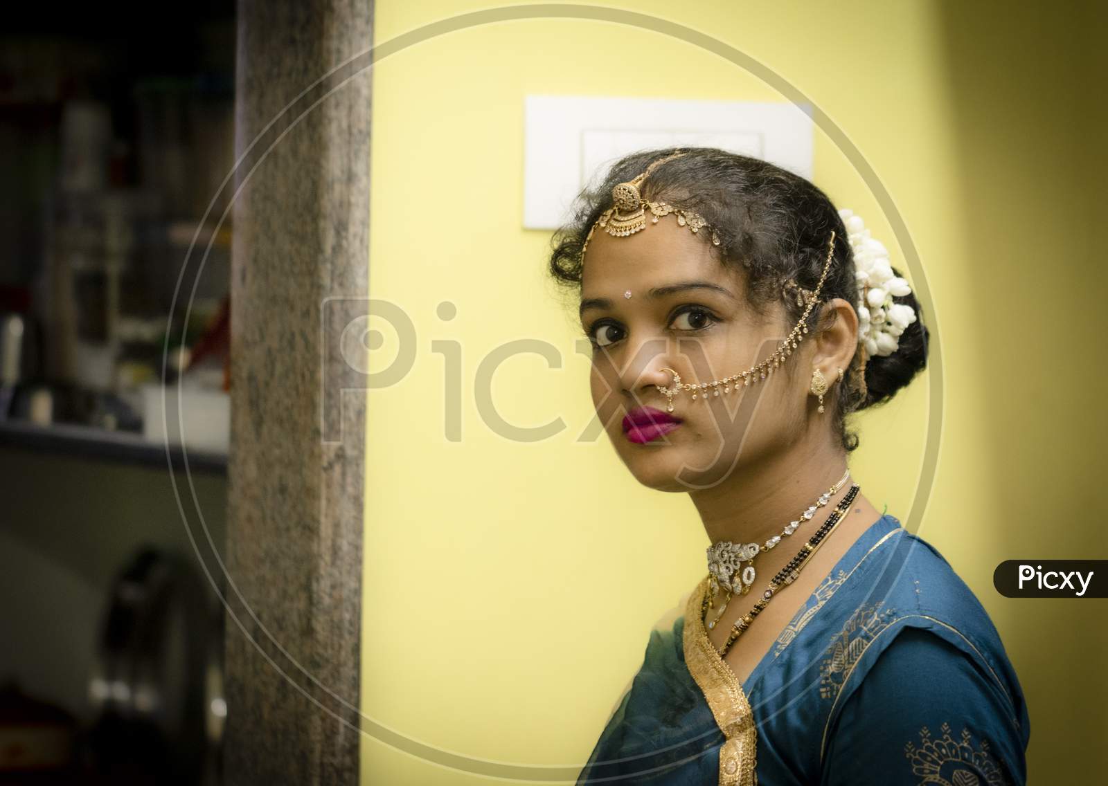 Gorgeous South Indian Woman With Red Lipstick On Lips