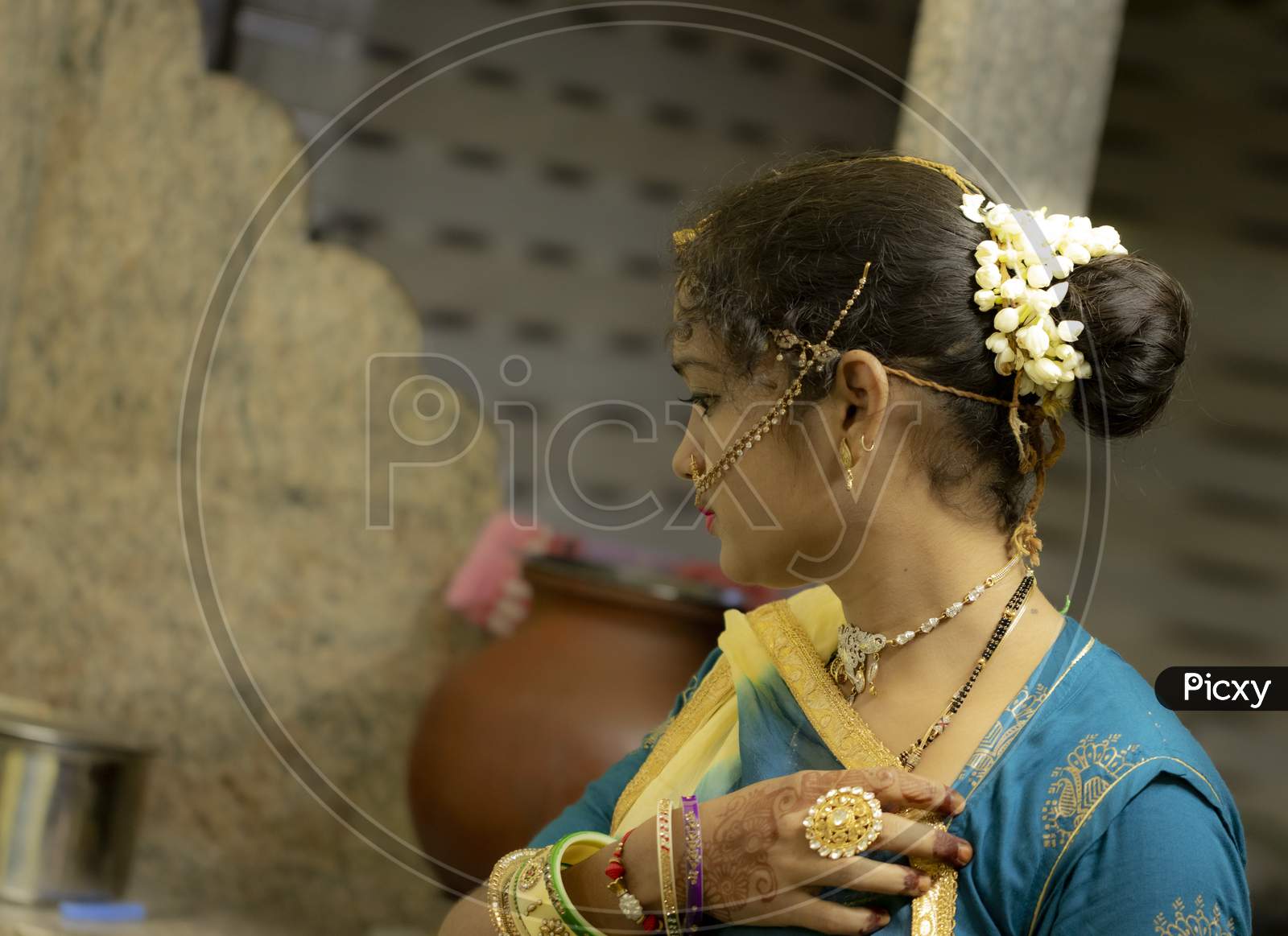 Indoors Gorgeous Girls With White Jasmine Flowers Garland On Her Hairs