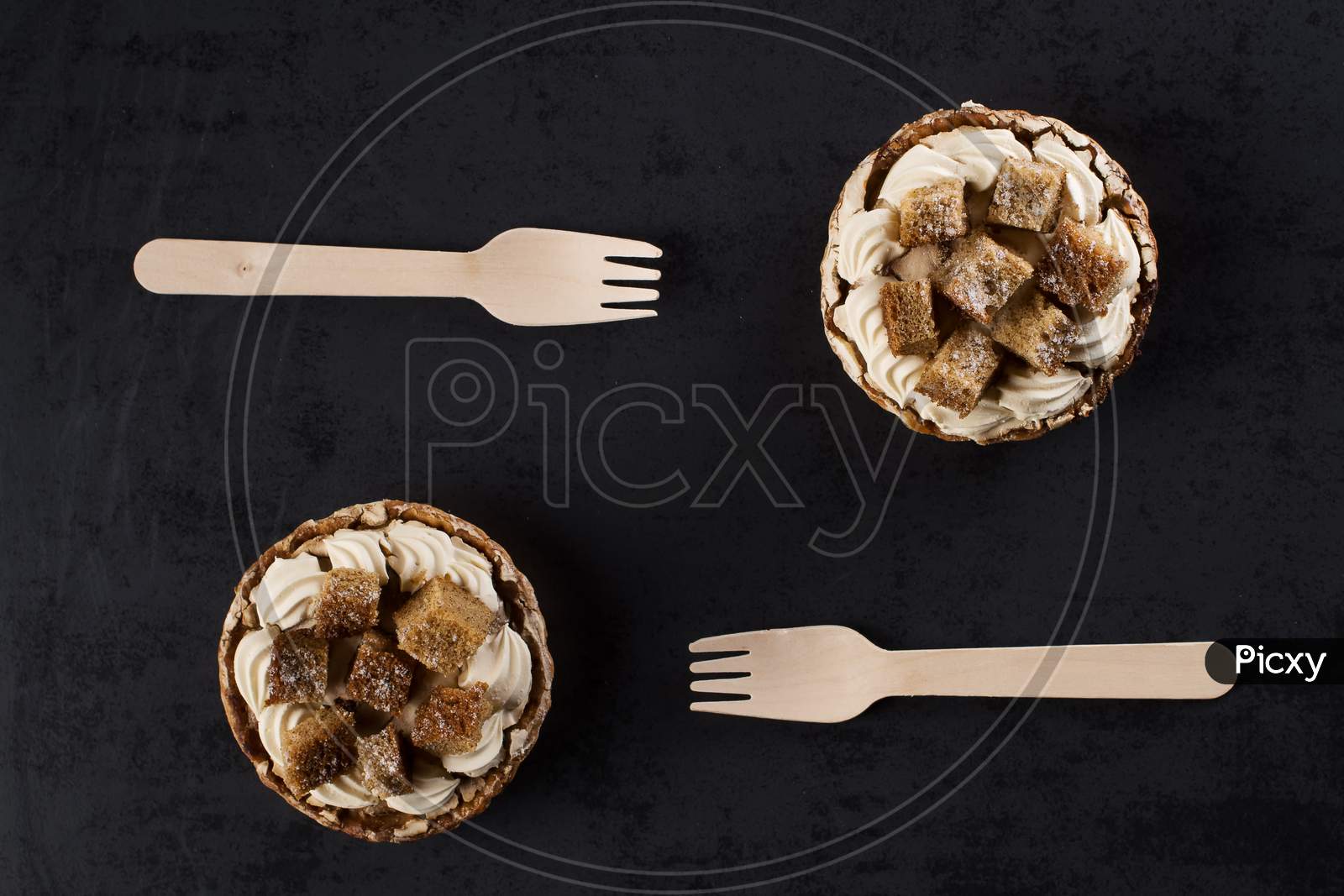 Two Banofee High Banana Pie With Wooden Disposable Fork