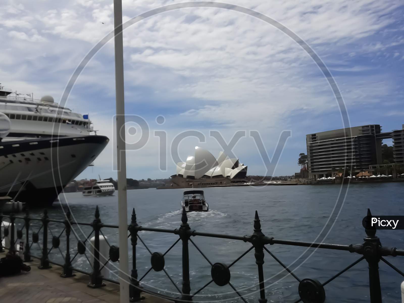 Sydney Australia ,10/10/2014 ,View Of Opera House From Sydney Port And Large Passenger Ship Docked In The Pier