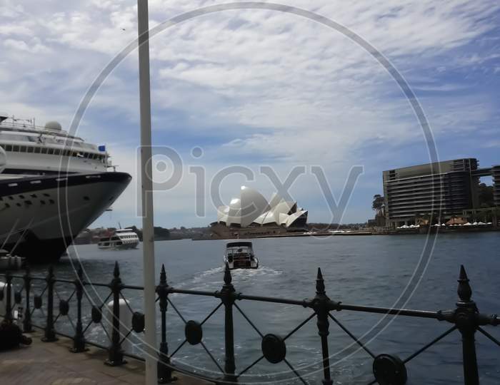 Sydney Australia ,10/10/2014 ,View Of Opera House From Sydney Port And Large Passenger Ship Docked In The Pier