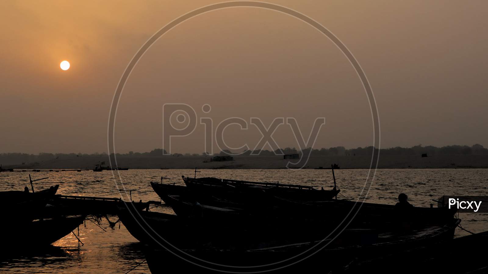 Bokeh shot of boats in the river Ganges with selective focus in Varanasi.