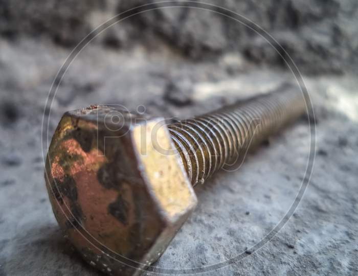 A macro picture of metallic screw.