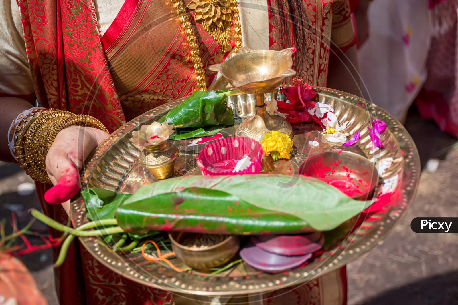 A Women Holding A Borondala (Pooja Thali For Worshipping God) In Sindur Khela At A Puja Pandal On The Last Day Of Durga Puja.