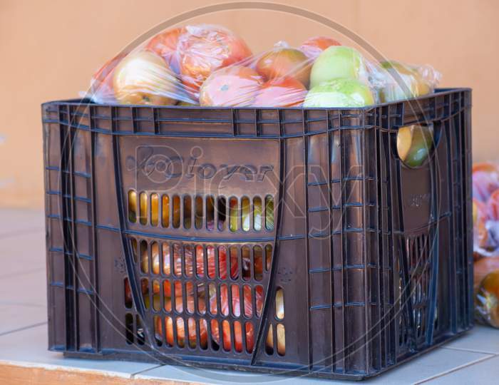 Red Ripe Tomatoes Packaged On A Crate