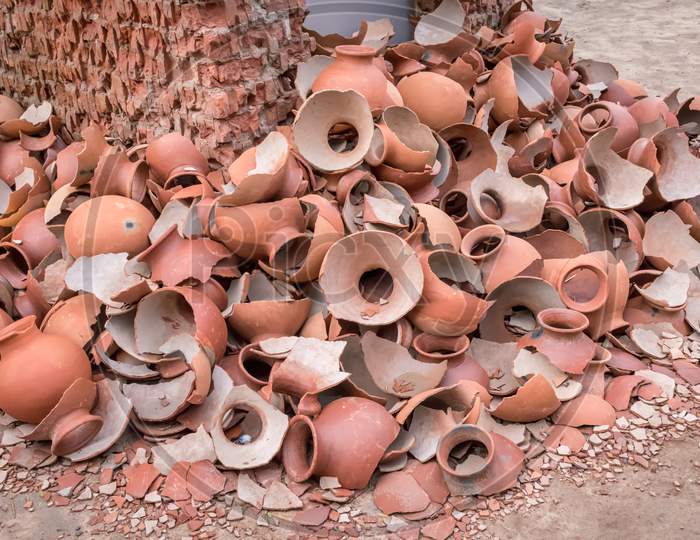 Picture Of Pile Of Broken Clay Pottery Or Earthenware Or Traditional Jar On Abandoned Hut.