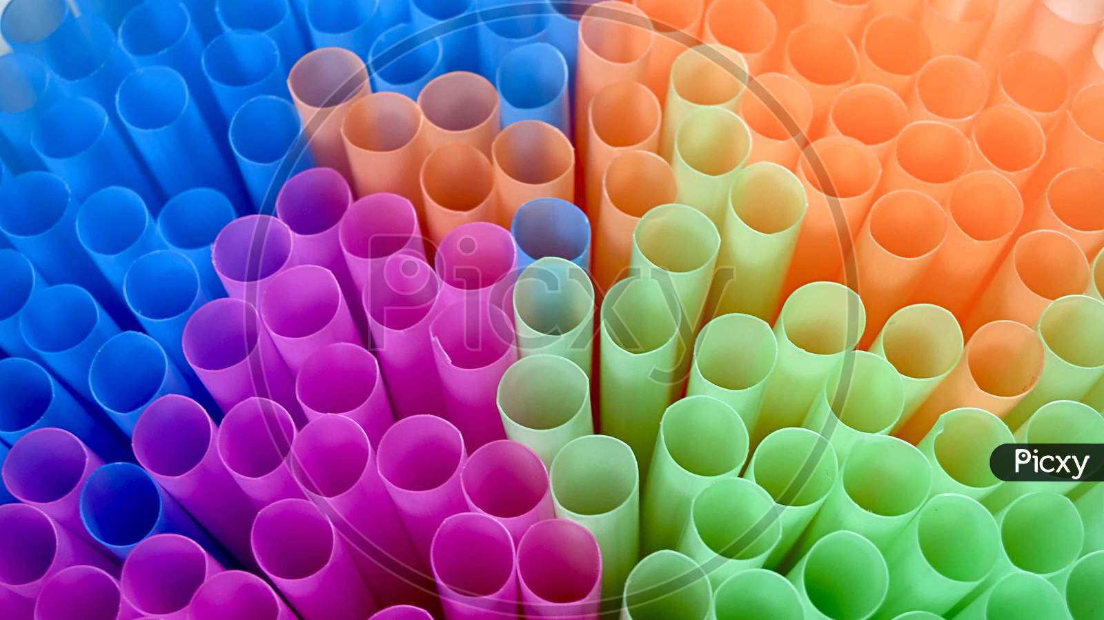 Bunch of colourful drinking straws in close-up