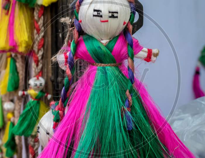 Colourful Decorative Wall Hangings, Dolls Made Of Jute, Handicrafts For Sale (Selective Focus)