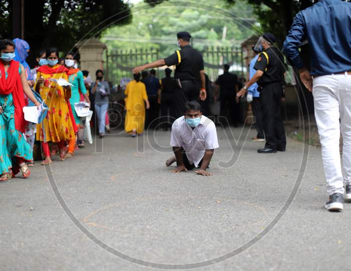 A differently abled Applicant Arrives To Attend B Ed Entrance Examination During Lockdown To Slow The Spread Of The Coronavirus Disease (Covid-19) At Allahabad Central University In Prayagraj, August 9, 2020.