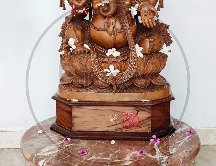 Lord Ganesha carved out of brown stone