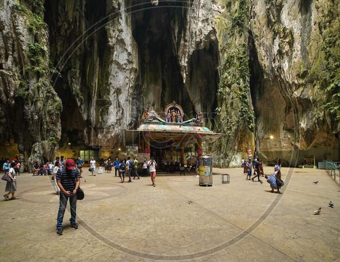 The Batu Caves Lord Murugan Statue and entrance near Kuala Lumpur Malaysia. Batu Caves has three main caves featuring temples and Hindu shrines.