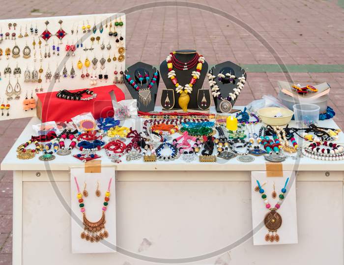 Picture Of Handmade Indian Necklace And Earring Is Displayed In A Street Shop For Sale. Indian Handicraft And Art
