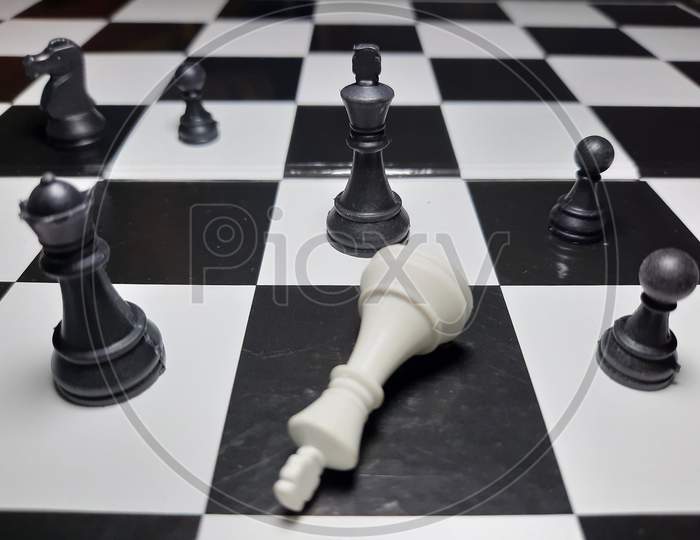 Chess Game Black King Defeating White King Stock Photos,