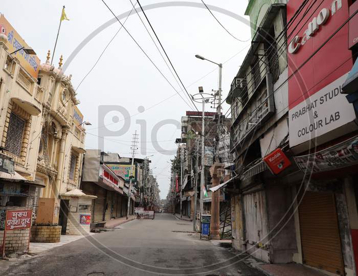 Deserted look of a market during complete lockdown on weekends to curb COVID-19 spread, in Jammu, on August 9 ,2020.