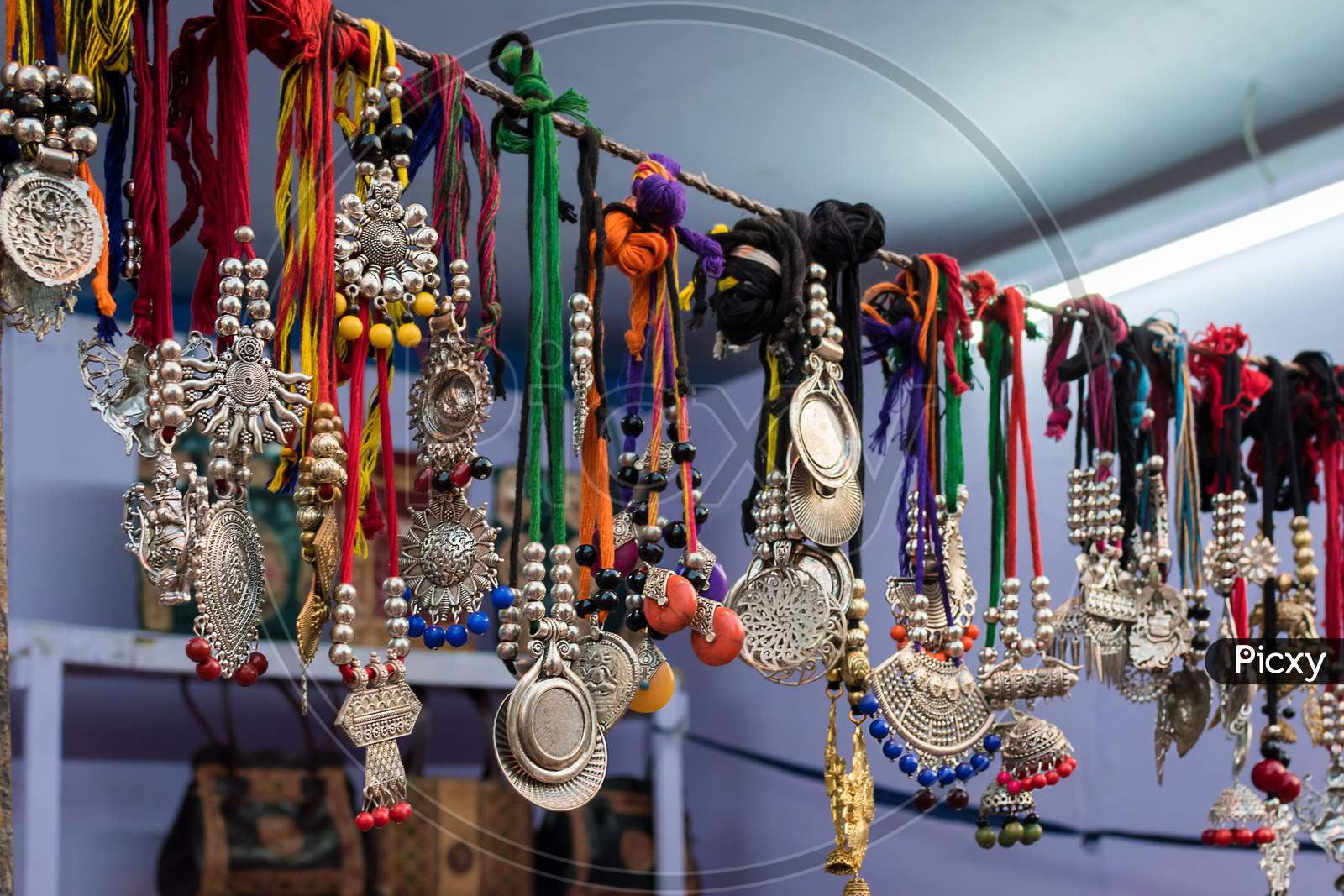 Picture Of Antique Handmade Indian Gemstone Necklace Is Displayed In A Street Shop For Sale. Indian Handicraft And Art