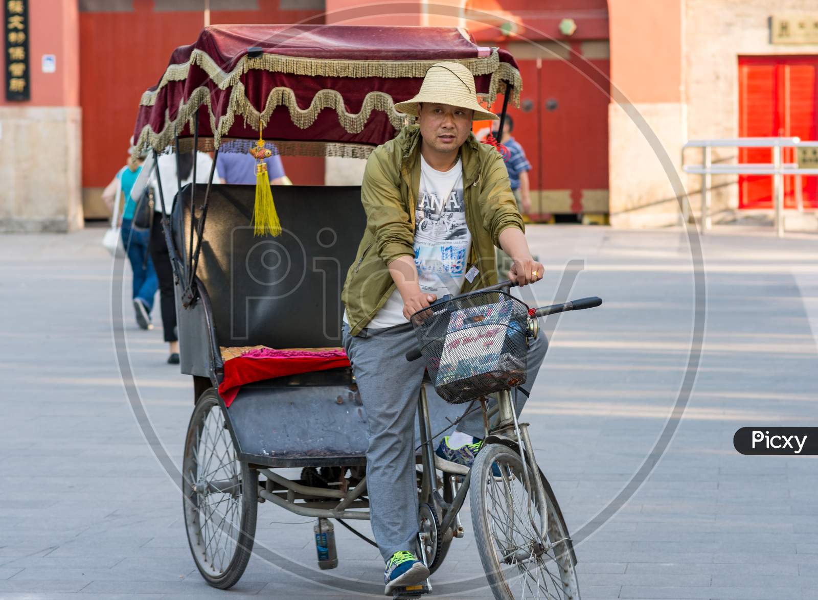 Bicycle Rickshaw Driver Waiting For Customers In Beijing, China