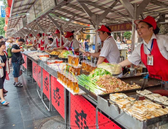 Vendors Selling Street Food In Wangfujing Street In Downtown Beijing, China