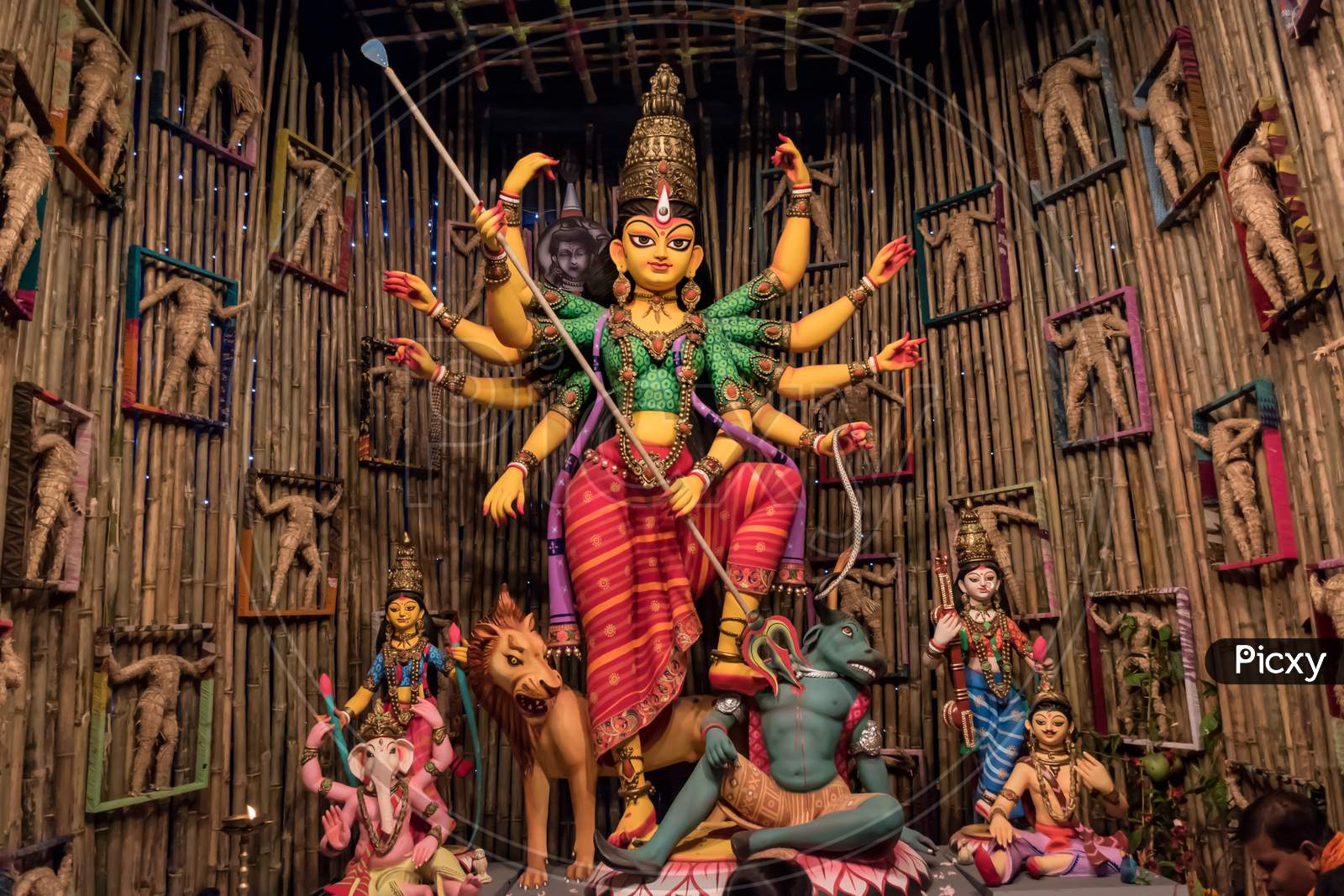 Goddess Durga Idol At Decorated Durga Puja Pandal, Shot At Colored Light, At Kolkata, West Bengal, India. Durga Puja Is Biggest Religious Festival Of Hinduism And Is Now Celebrated Worldwide