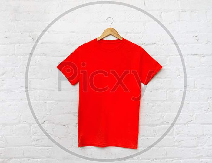 Red t-shirt on cloth hanger