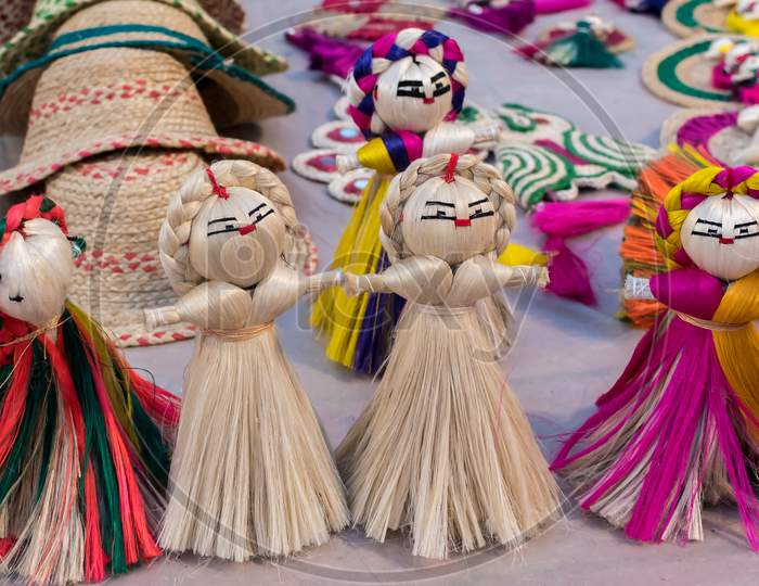 Colourful Decorative Wall Hangings, Dolls Made Of Jute, Handicrafts For Sale (Selective Focus)