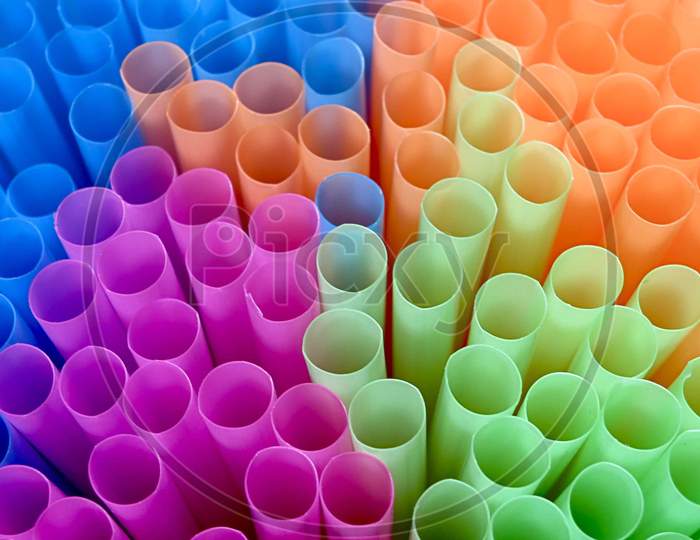 Bunch of colourful drinking straws in close-up