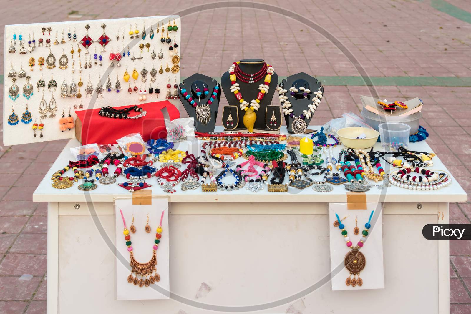 Picture Of Handmade Indian Necklace And Earring Is Displayed In A Street Shop For Sale. Indian Handicraft And Art