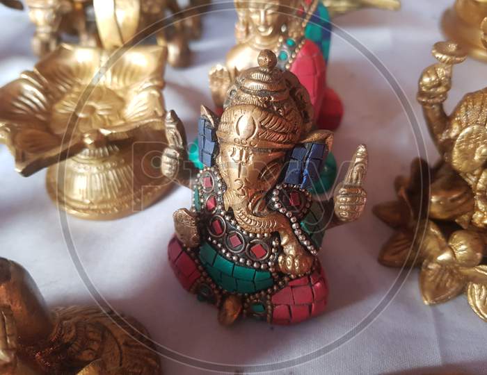 image-of-gold-colour-metal-hindu-statue-of-god-idols-in-home-lb987223-picxy