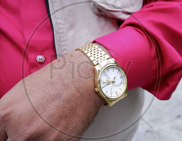 Close Shot Of Golden Watch Wearing Handsome Young Man