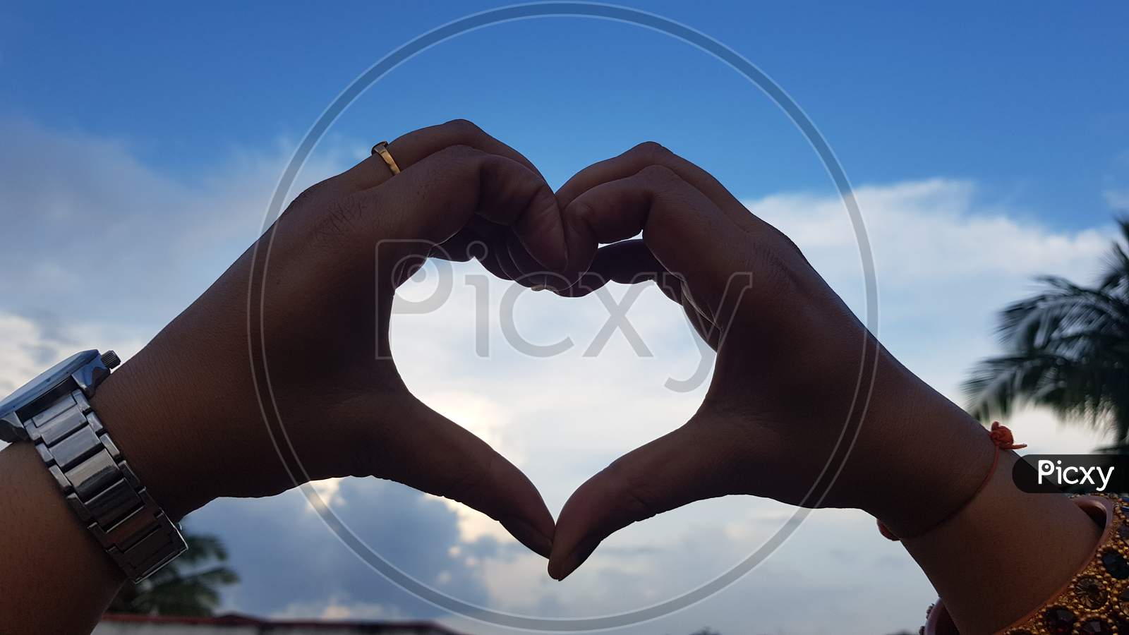 Female hands that make a heart shape. Heart shape with female