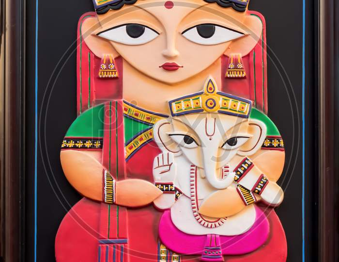 Parvati And Ganesh Isolated On Black Background