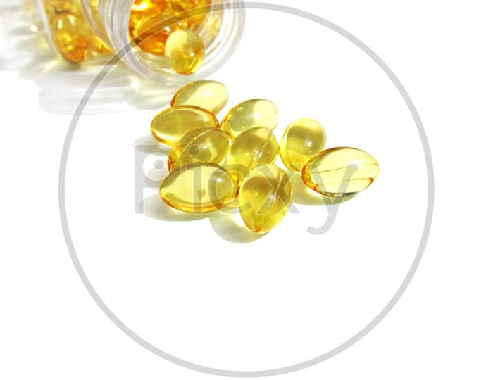 Cod liver oil  or fish oil gel capsules  on white background. It contains omega 3 fatty acids , EPA,  DHA