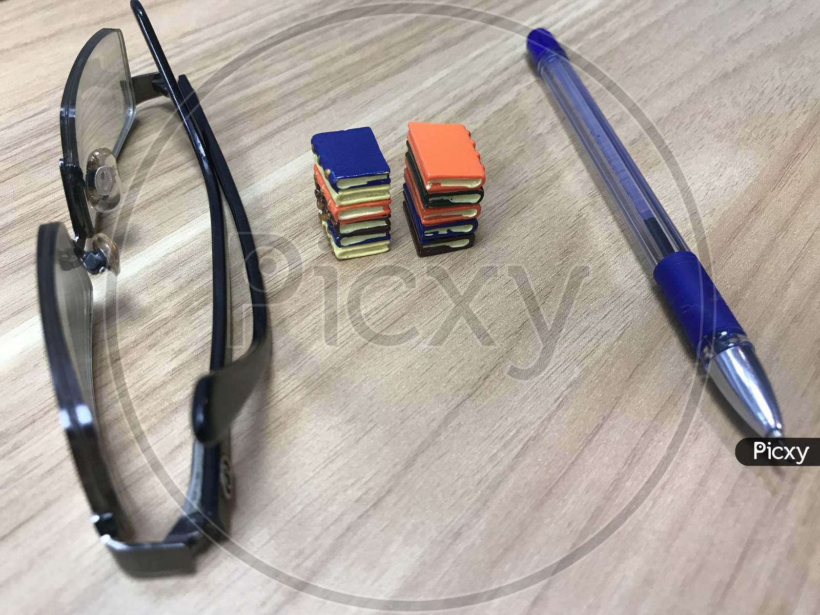 Book Toys And A Pen Representing A Life Of An Writer Who Can Impose His Ideas To People Who Like To Improve Their Literacy Level