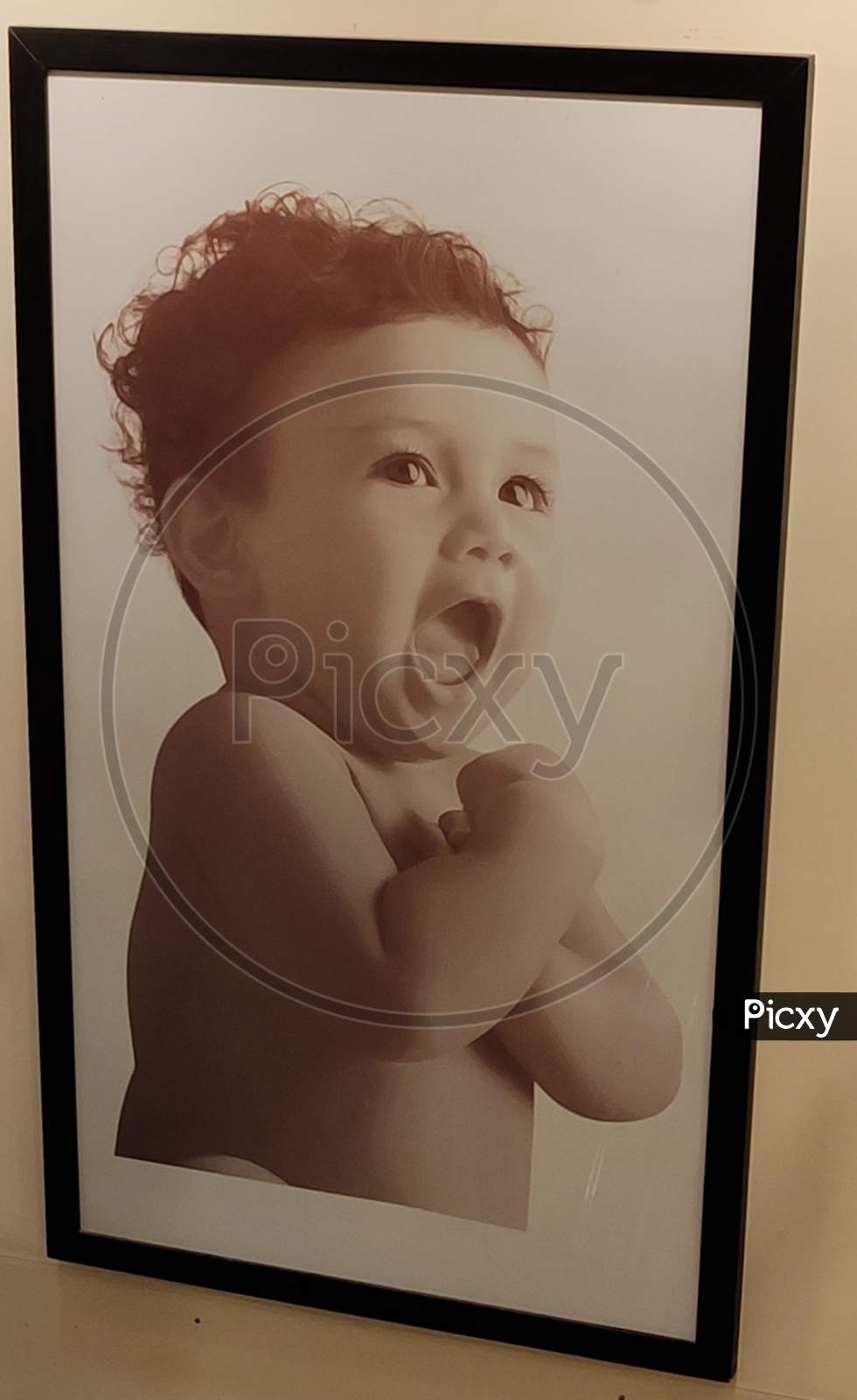 Baby photo frame on a wall