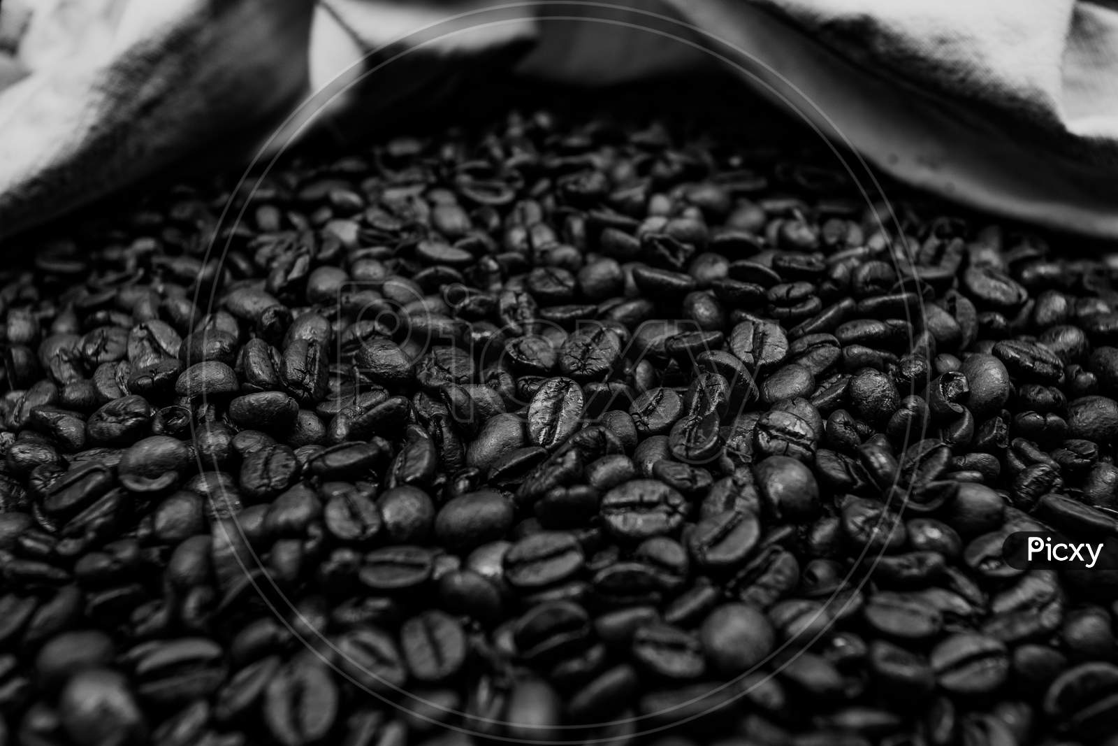 A Black And White Close Up Of A Lot Of Coffee Grain