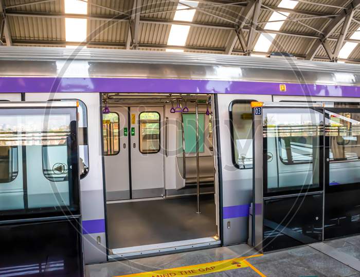Metro Train Stopping At A Station And Open The Door To Wait For Passengers To Enter During The Rush Hour At Metro Station Of Kolkata East West Metro System Kolkata.
