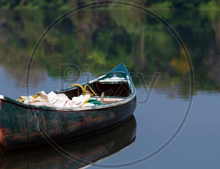 Boat Or Canoe In The Still Waters