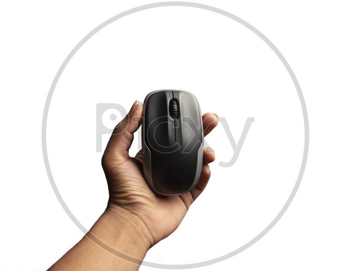 Hand Holding Computer Mouse Isolated On The White Background.Above View Of Computer Mouse On White Background. Black And Grey Computer Mouse.