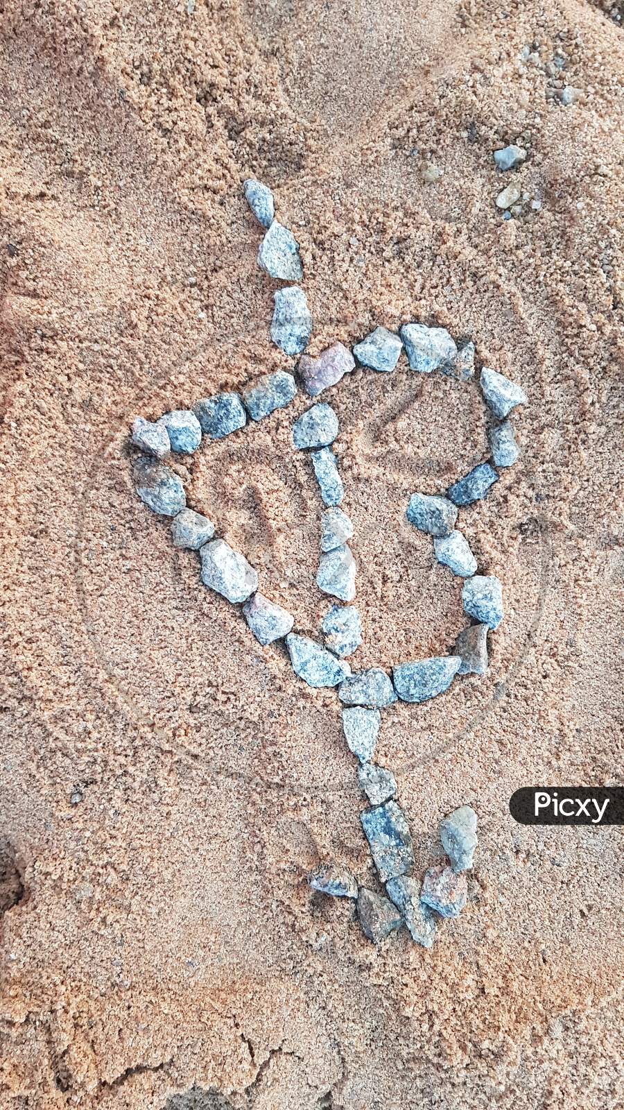 heart shaped stones on sand Background