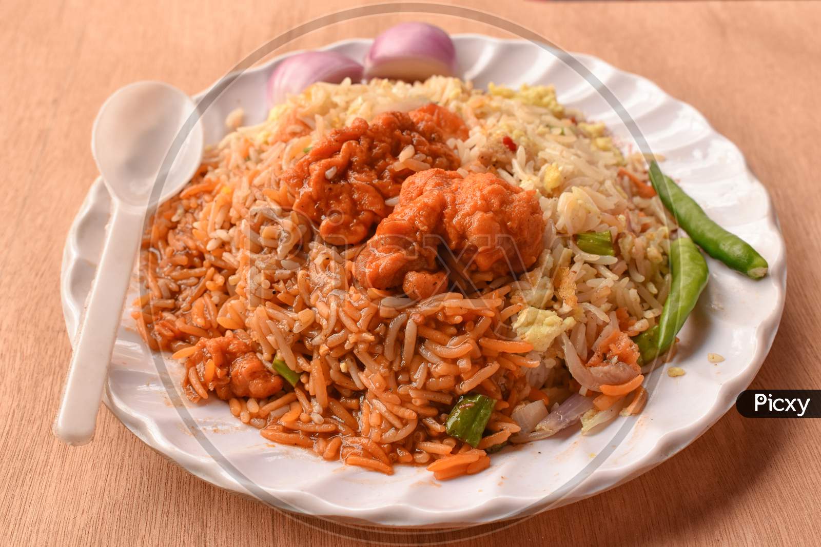 Chilli Chicken Is A Popular Indo-Chinese Appetizer Served With Vegetable Fried Rice.