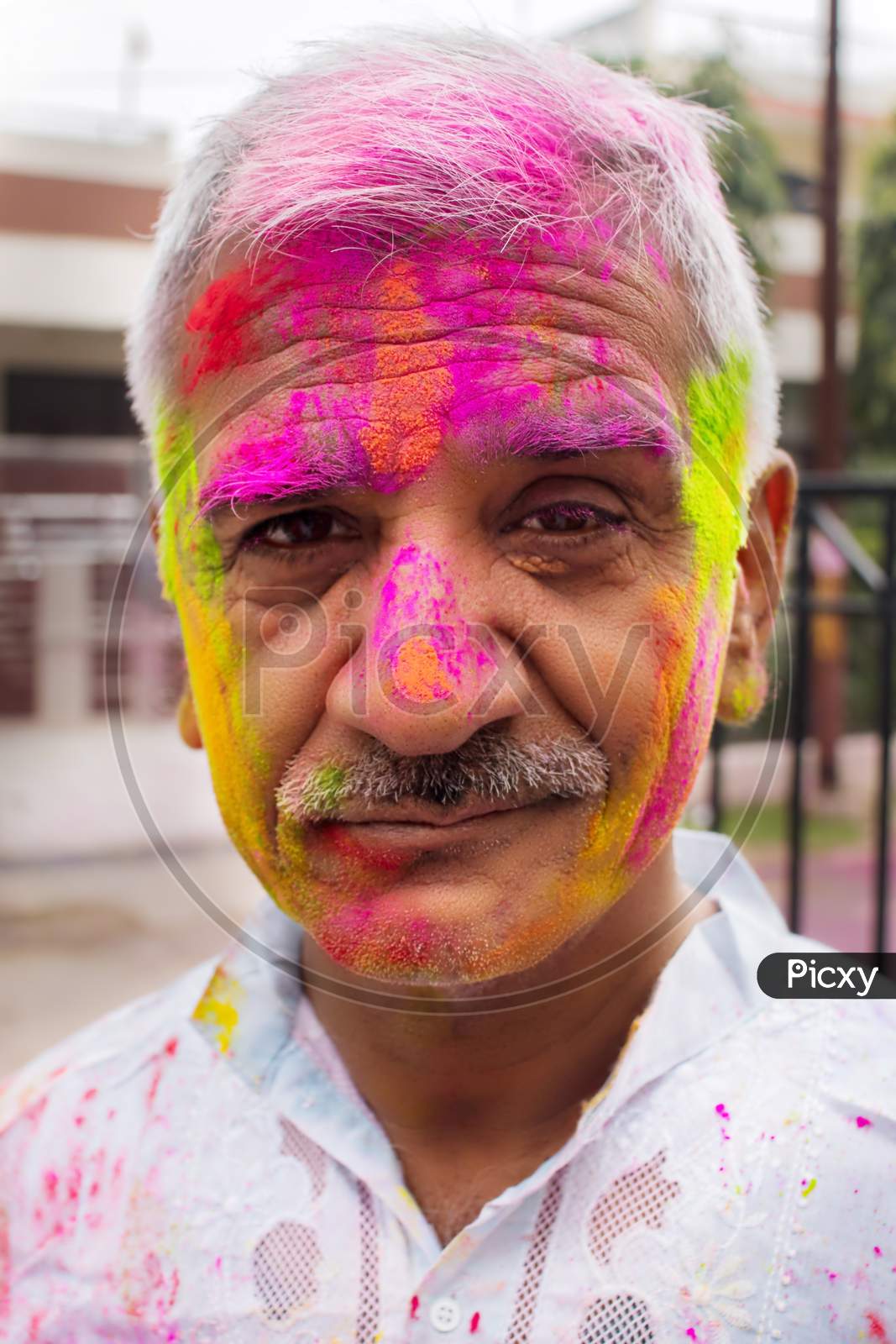 Man With Holi Colors On Face.